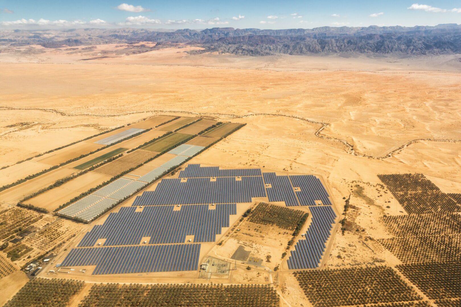 A large field of solar panels in the middle of nowhere.
